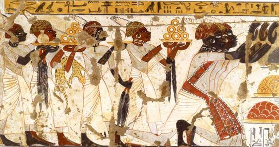 the image shows a fragment of an ancient egyptian mural, depicting a procession of figures carrying offerings. they are likely servants or officials bringing food and other goods as tribute to a pharaoh or deity. the figures are adorned in traditional egyptian clothing, with ornate headdresses and jewelry. the painting style is characteristic of ancient egyptian art, with its distinctive profile view and vibrant colors.  the background is a pale cream color, while the figures are depicted in various shades of brown, red, and yellow. the hieroglyphics above provide further context to the scene.
