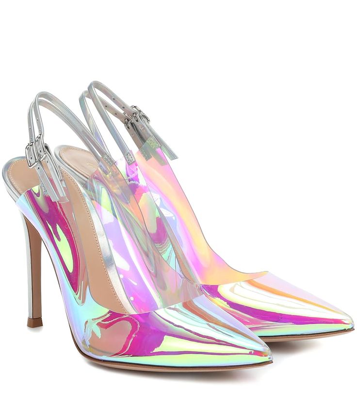the image shows a pair of women's iridescent, transparent slingback high heels. the shoes have a pointed toe and stiletto heel. the material appears to be a clear pvc or plastic with a holographic, rainbowlike effect that shimmers with pastel shades of pink, purple, green, and blue.  the shoes are positioned slightly angled, with one shoe in front of the other, showcasing their design and iridescent sheen.  the overall aesthetic is sleek, modern, and fashionable.