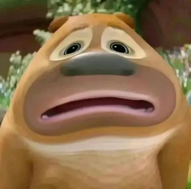 the image shows a cartoon dog with a large, exaggerated frown and wide, worried eyes. the dog's fur is a light brown, and its nose is a dark brown. the background is a blurry green, suggesting grass. the overall impression is that the dog is very sad or anxious about something.