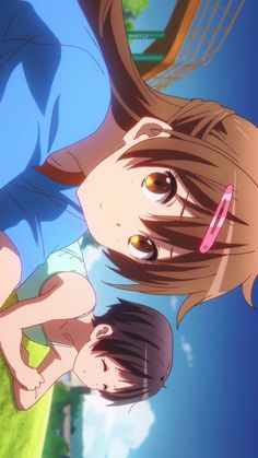 the image shows an anime drawing of two young girls in a park. the girl in the foreground has short brown hair and blue eyes and is wearing a white and blue school uniform. the girl in the background has long brown hair and brown eyes and is wearing a blue and white school uniform. the background is a blue sky with some clouds. the girls are both smiling and look happy.