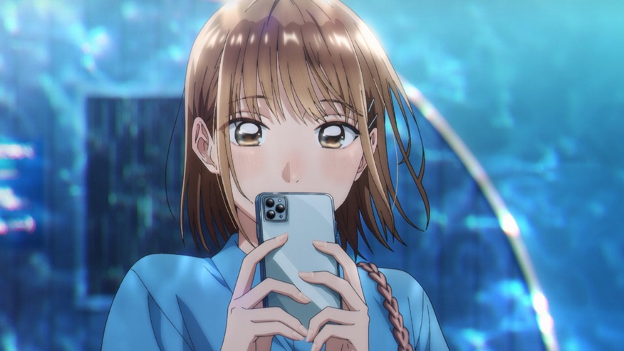 loseup view of an animestyle girl with short brown hair, holding a smartphone in front of her face. she appears to be looking at the phone's screen, and her expression is soft and slightly flushed. her outfit is a casual blue shirt. the background is a blurry, bright blue scene, possibly suggesting a water setting or a digitally enhanced background. the overall style is vibrant and detailed, typical of modern anime animation.