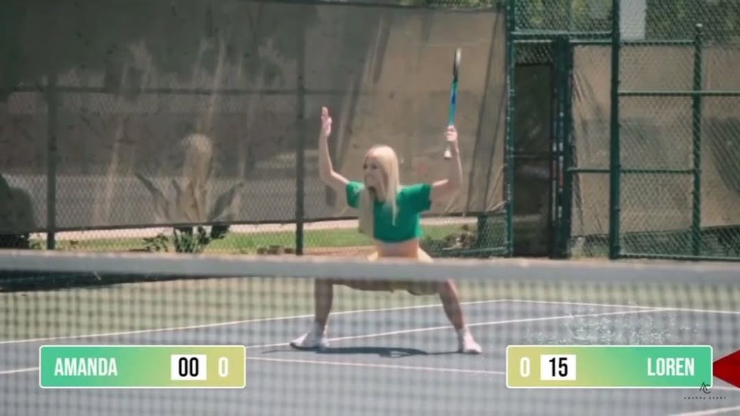 the image shows a woman playing tennis on a tennis court. she is wearing sportswear and holding a tennis racket. the score is displayed on the bottom, with loren leading amanda 150. the tennis court has a net and is surrounded by a fence. the sun is shining.