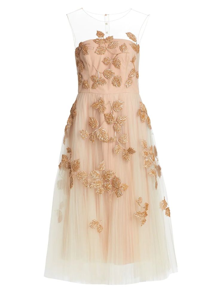 a tealength evening gown in nude color with gold embroidery is depicted on a white background. the dress has a sheer neckline and sleeveless bodice with gold leaf embroidery, and a full tulle skirt with scattered gold leaves.
