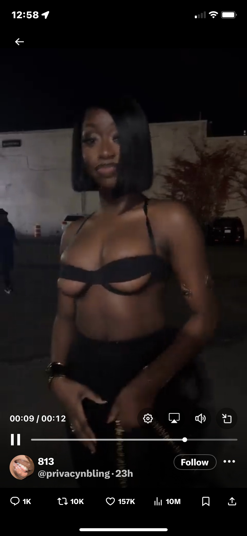 the image is a still from a tiktok video featuring a young black woman with a short bob haircut. she's wearing a black, revealing cutout top and dark clothing. the setting appears to be outdoors at night, possibly at a party or event. the video has garnered significant engagement on tiktok, with over 157k likes and 10 million views.  the tiktok username @privacynbling is visible. the overall tone suggests a glamorous, fashionable portrayal of the woman.