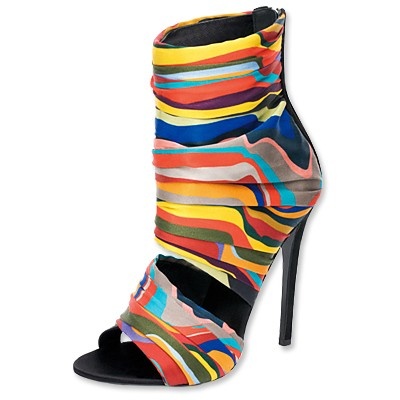 a pair of colorful, striped opentoe high heels with ankle strap. the heels are black and the straps are made of a colorful, striped fabric.