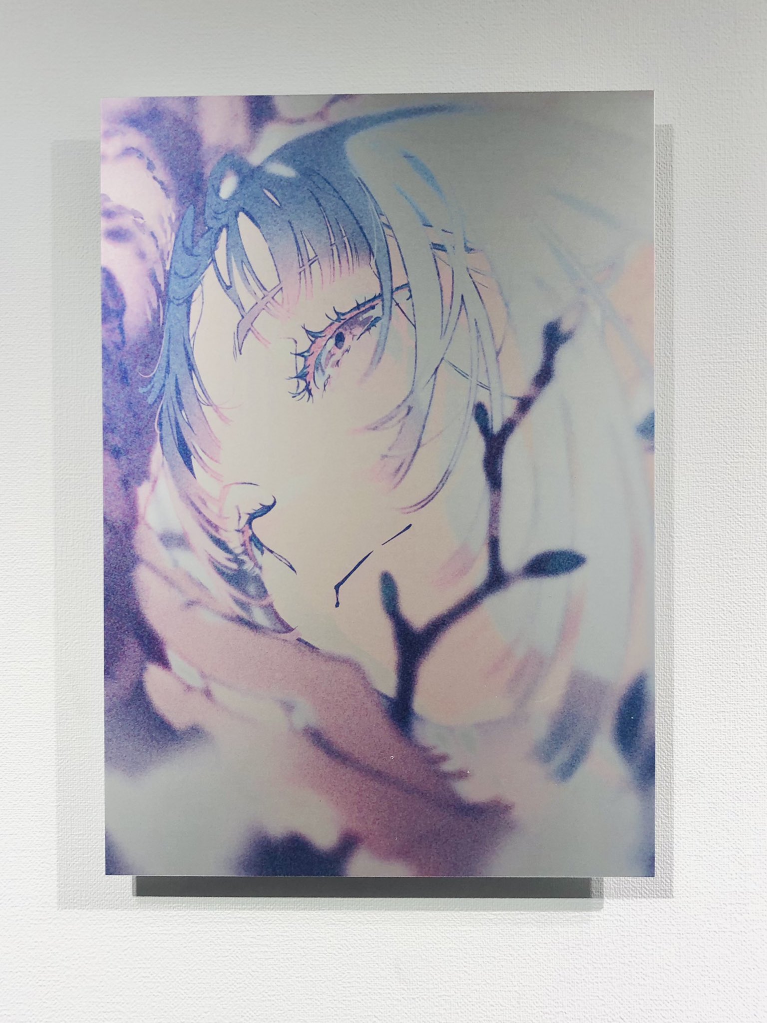 a digital art print of a young woman with short, choppy blue hair. she has large, expressive eyes and a delicate, ethereal appearance. the artwork has a soft, dreamy quality, with a muted color palette of pinks, purples, and blues. the woman is the focal point of the image, and her gaze draws the viewer in.  the background is abstract and textured, adding to the overall ethereal feel of the piece.