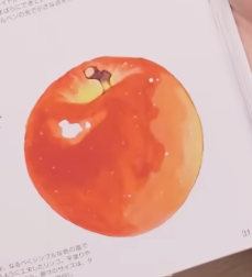 a digital illustration of a red apple with a yellow highlight on a white background. japanese text is partially visible on the bottom of the image.