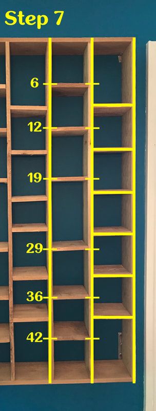 the image shows a set of wooden shelves with vertical dividers. yellow lines and numbers indicate specific measurements, labeled as "step 7," potentially illustrating instructions for a diy project or the design of the shelving unit.