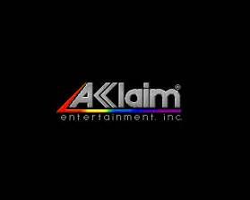 the image is a logo of aklaim entertainment inc. which is a video game company.  it has a black background with a grey triangle with the word aklaim in bold and rainbow colored letters. below the word aklaim in a smaller font, it says "entertainment. inc".