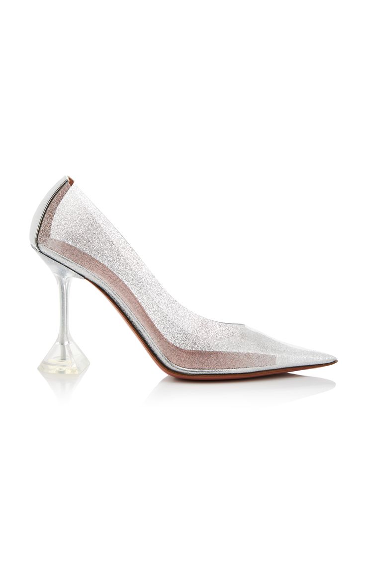 a pair of silver glitter pointed toe stilettos with clear heels. the heels are very high and are in the shape of a diamond. the shoes are a very sparkly and elegant design.