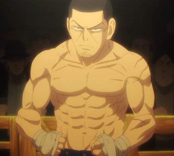 the image shows a muscular man with a determined expression standing in a boxing ring. he is shirtless and wearing boxing wraps on his hands. the lighting is dramatic, with a spotlight shining on him from above. the overall atmosphere is one of intense anticipation.