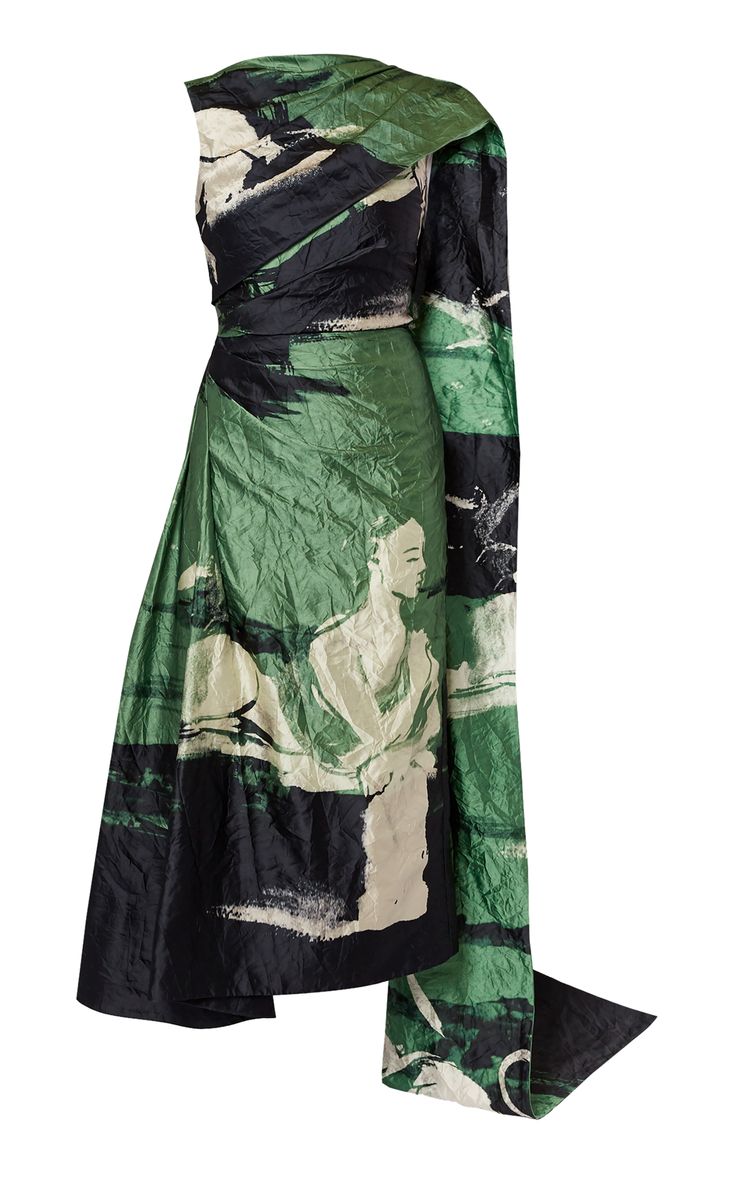 a long, green and black silk dress with a oneshoulder design. the dress is cinched at the waist, with a flowing skirt that drapes asymmetrically. the dress is adorned with a bold print of abstract shapes and figures in green, black, and white. it's a statement piece that's perfect for formal occasions.