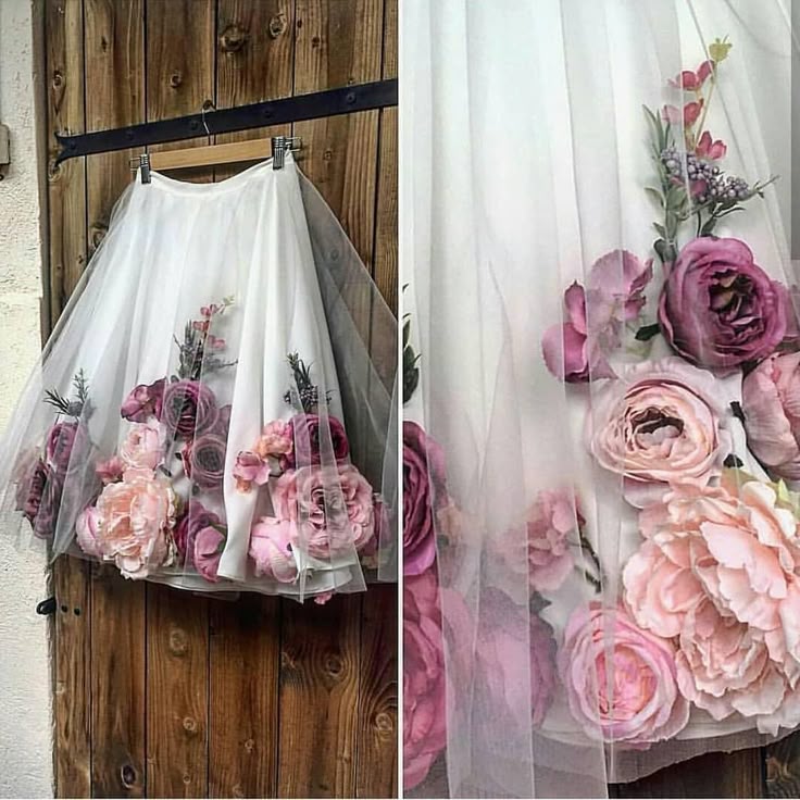 a white tulle skirt with pink and purple flower embellishments is displayed on a hanger against a wooden door. a detail shot on the right shows a closeup of the floral arrangement on the skirt.