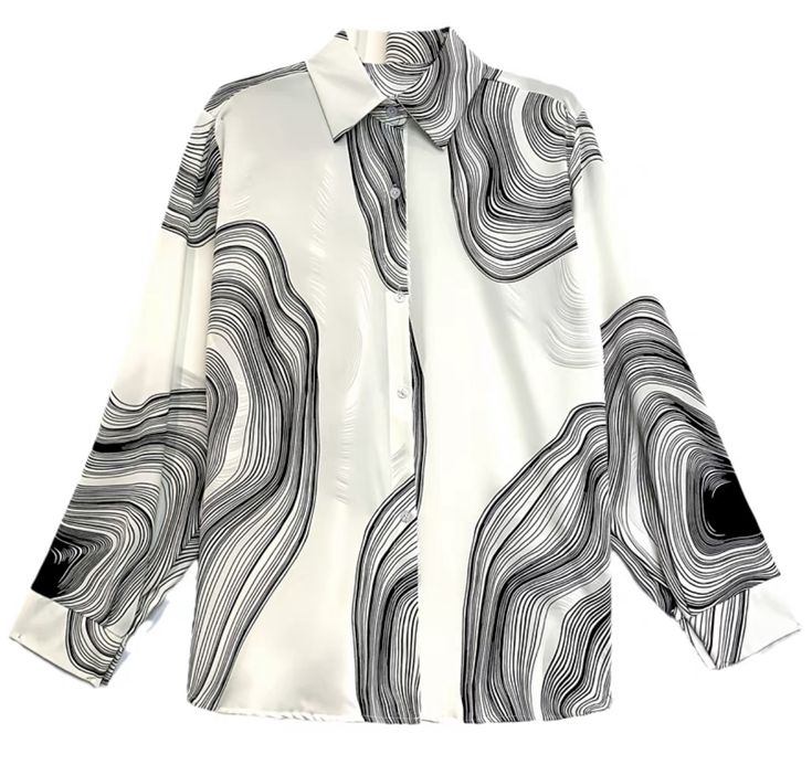 a white, longsleeved buttondown shirt with a black swirling pattern is laid out on a white background. the pattern consists of closely spaced black lines that create an organic, wavy appearance. the shirt is partially buttoned and has a collar.