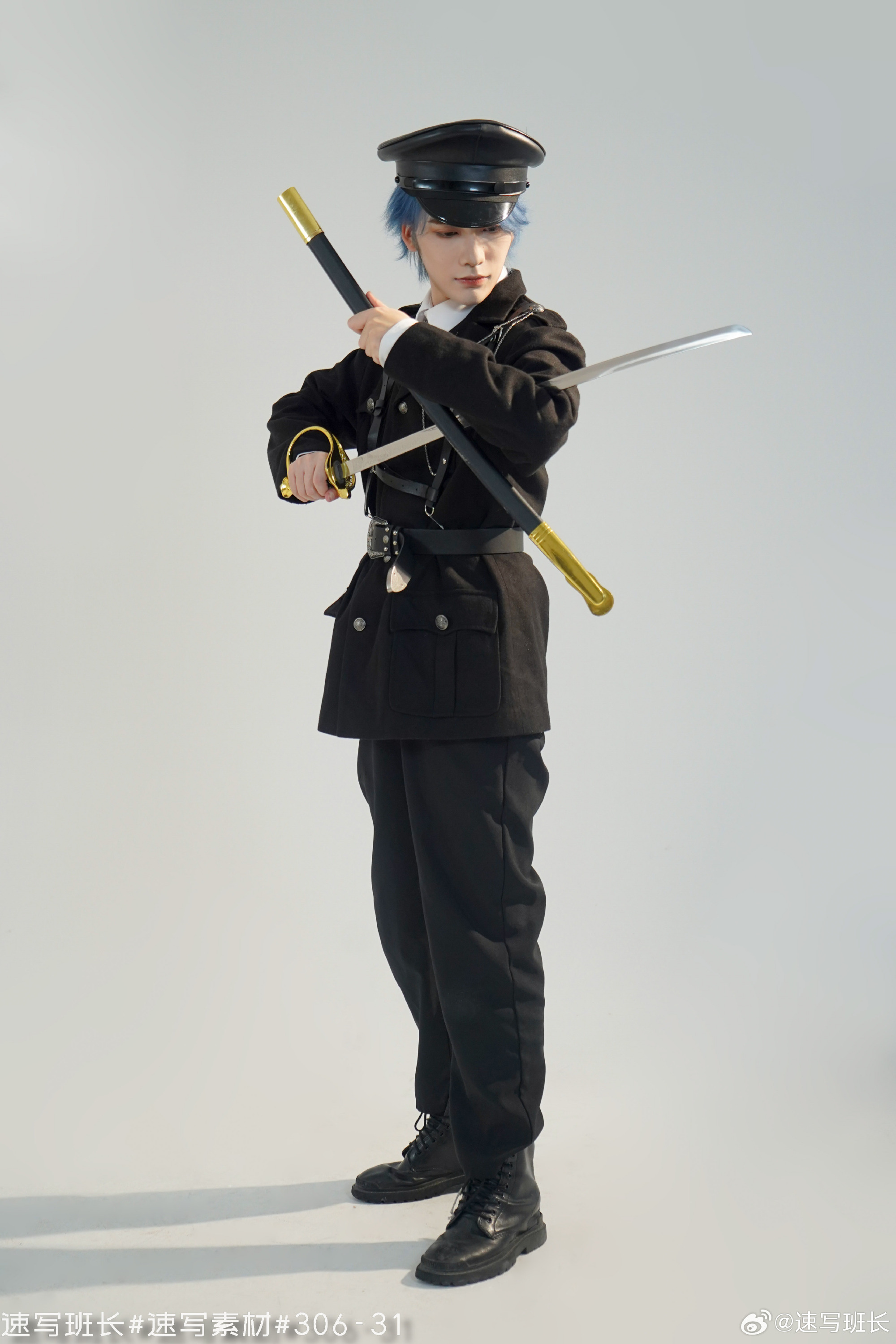 a young man is posing in a studio setting wearing a black militarystyle uniform and cap. he has blue hair and is holding a sword in each hand, crossing them in front of his body. the lighting is artificial and the background is a plain light gray.