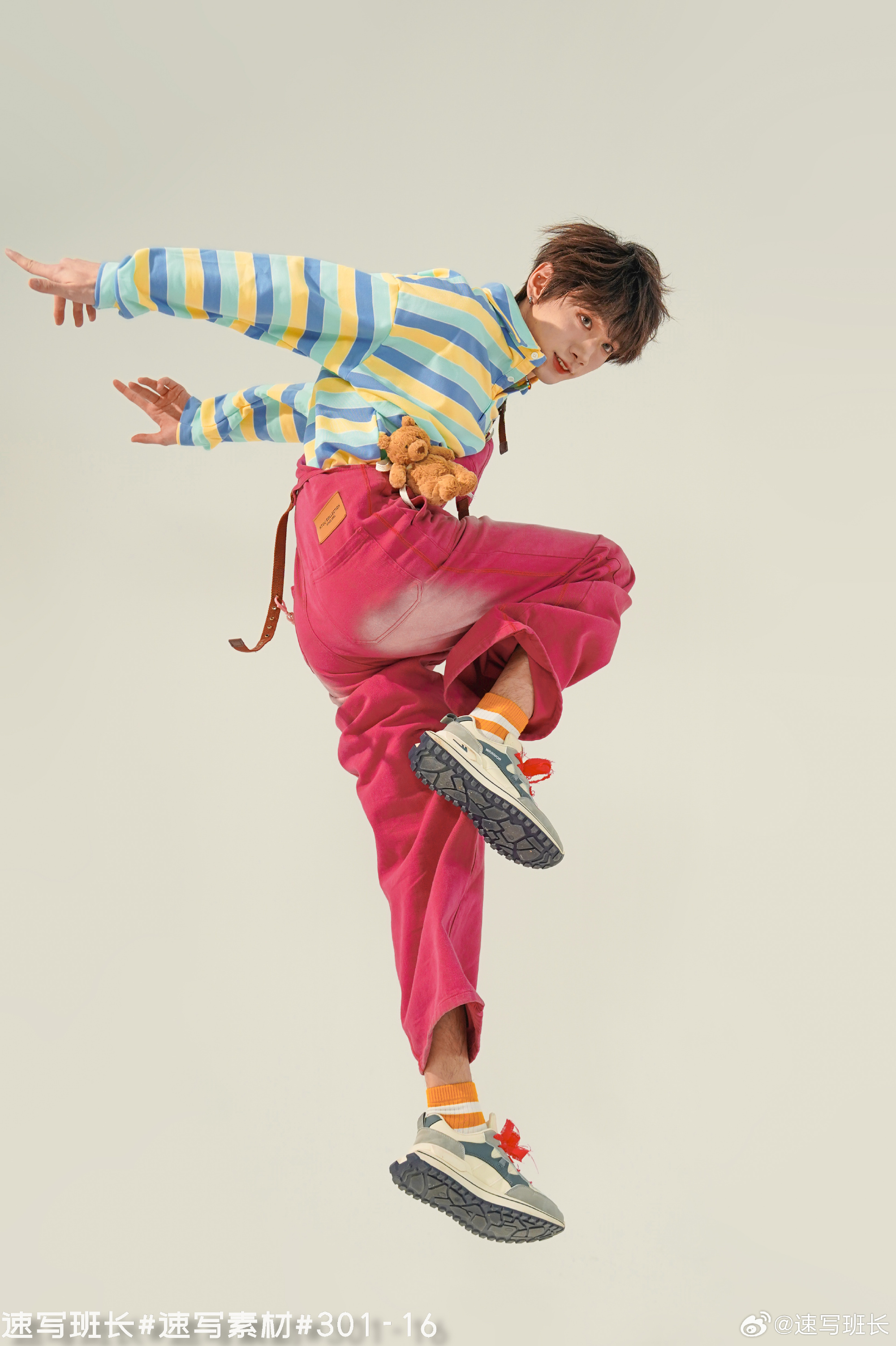 a young man in colorful attire is captured midair, executing a dynamic jump against a minimalist white background. his playful outfit, comprising a striped top, bright pink overalls, and chunky sneakers, exudes a youthful and trendy vibe. the soft, bright lighting accentuates the vibrancy of the colors and highlights the subject's energetic pose. the low angle perspective adds to the sense of movement and dynamism.