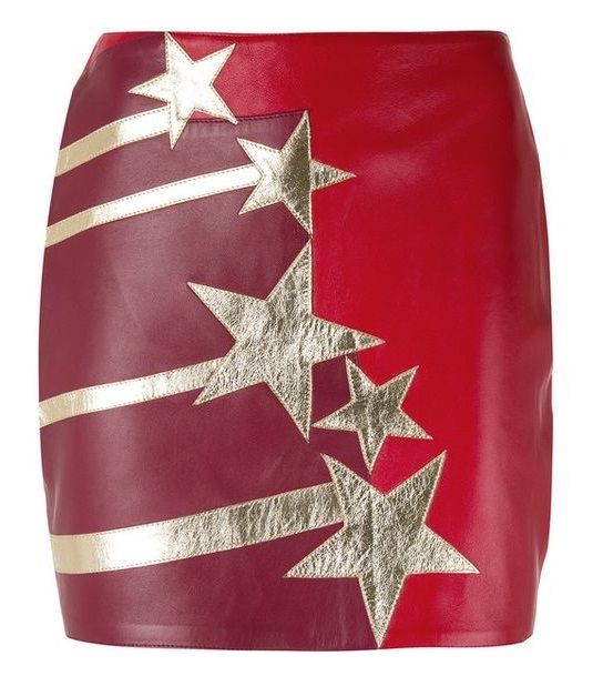 a red and maroon leather mini skirt is decorated with gold shooting star and star patterns.