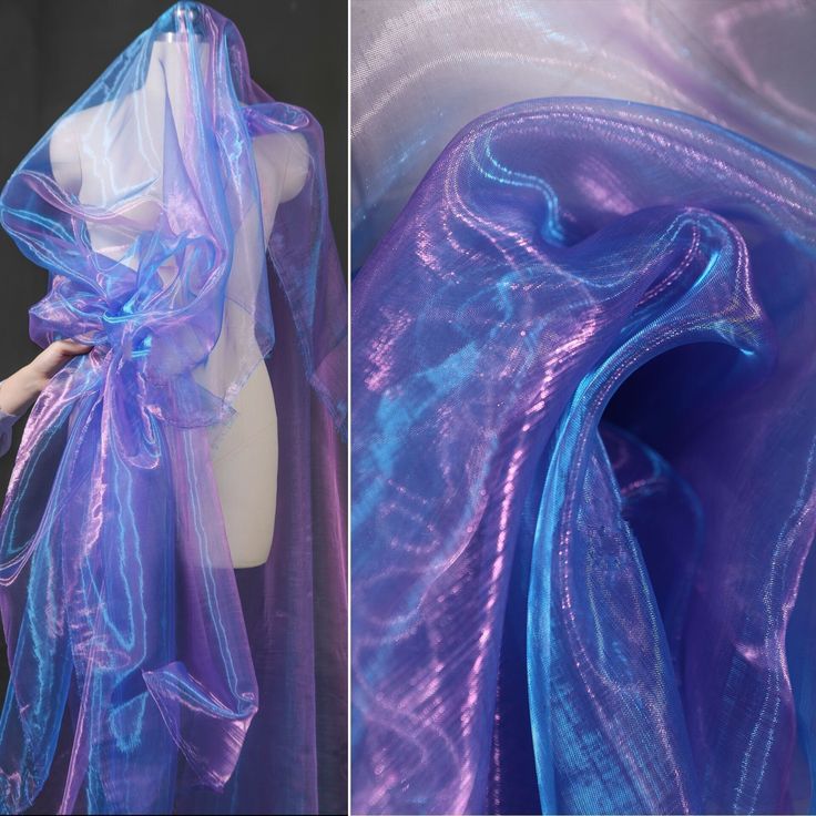 the image shows a closeup of iridescent ombre tulle fabric. the fabric is a soft, sheer, and delicate material with a dreamy and magical quality. it is available in shades of blue and purple. the fabric is perfect for a variety of projects, including wedding dresses, bridal gowns, party dresses, costumes, and craft projects.