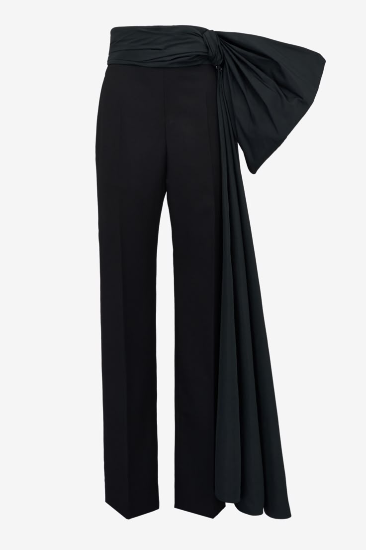 a pair of black, wideleg pants with a high waist and a large draped detail on one side. the drape creates a dramatic effect, giving the pants a unique and fashionable look.