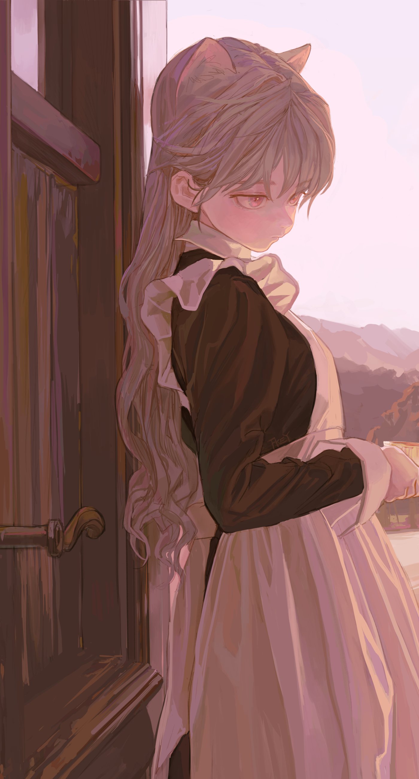 an anime girl with cat ears is wearing a black and white maid outfit and standing in front of a wooden door. in the background, there are mountains. the girl is viewed from the side.