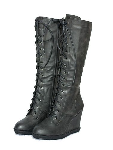 a pair of women's gray laceup kneehigh wedge boots are shown. the boots are made of faux leather and have a slight platform wedge heel. the laces go up the entire length of the boots. the boots are angled slightly to show both sides.
