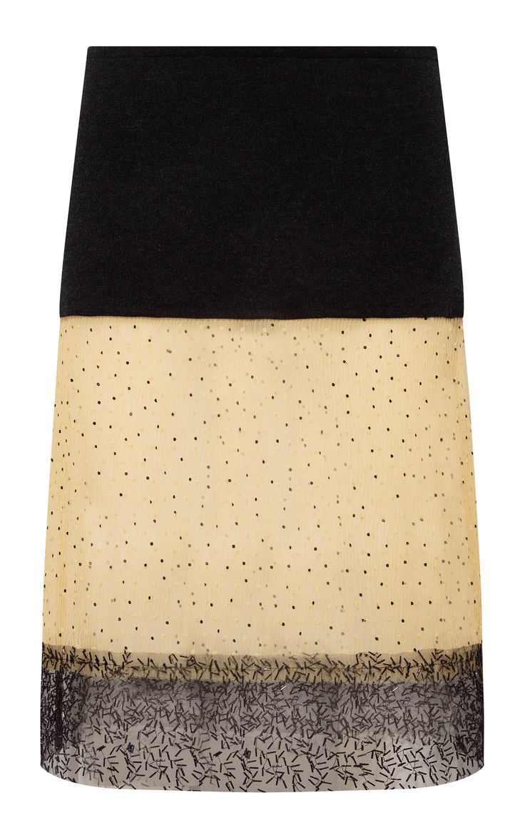 a yellow tulle skirt with black polka dots and a black waistband. it is a short skirt, meant for a woman. it is a fashion item that can be worn casually or for a special occasion.
