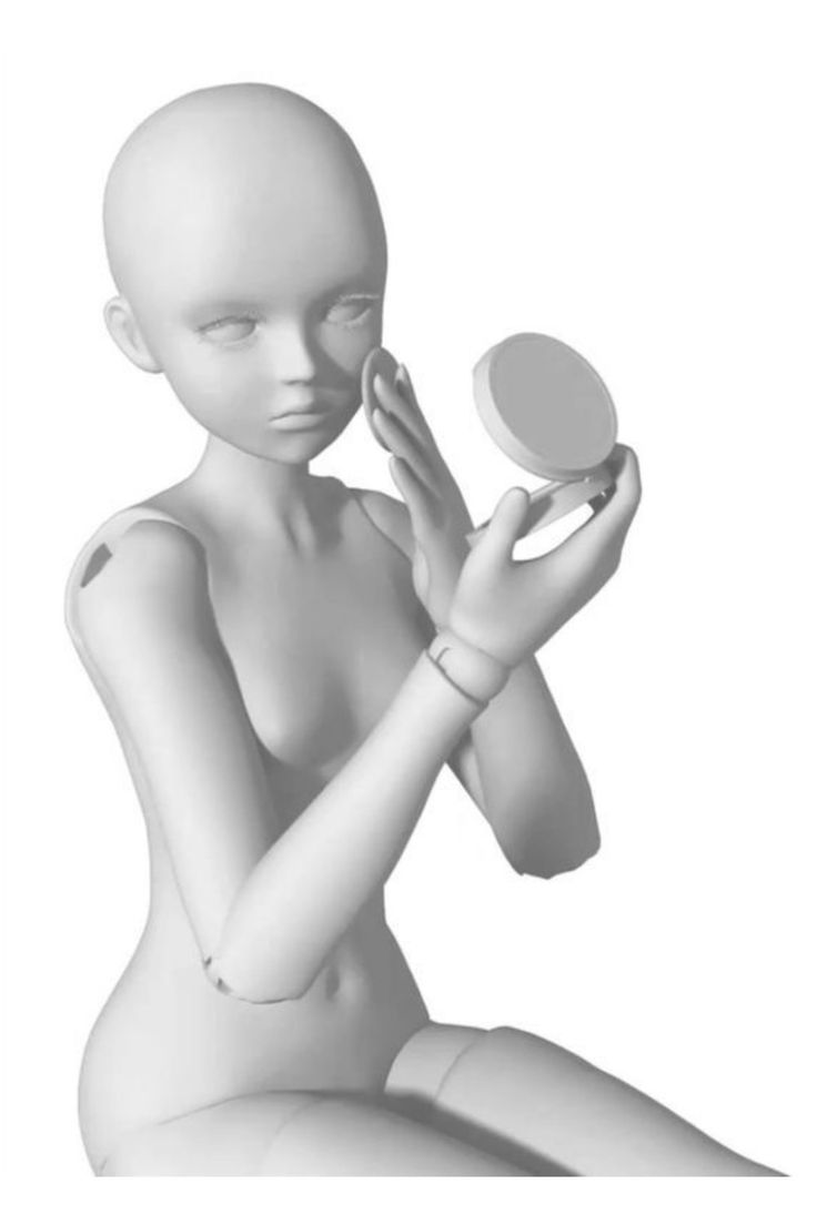 a white plastic doll is holding a compact mirror in her hand. she is looking at herself in the mirror and applying makeup.