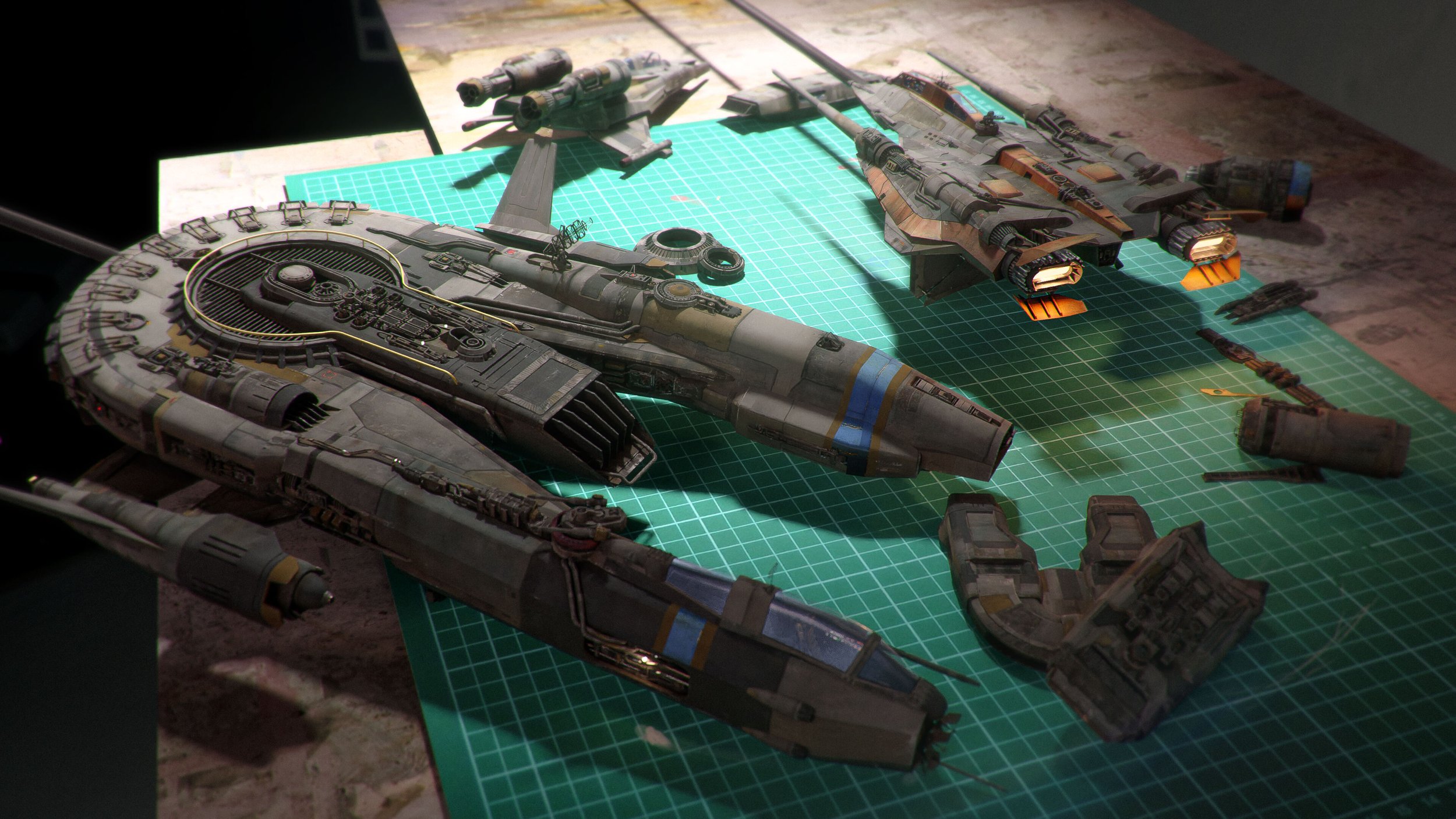 a closeup shot of several model spaceships in various stages of construction.  they are arranged on a green cutting mat, with some pieces appearing to be disassembled or in the process of being assembled. the spaceships are detailed and have a worn, slightly weathered appearance, suggesting a used or aged aesthetic. the lighting creates shadows that emphasize the textures and details of the models. the overall scene is reminiscent of a modelbuilding workshop or hobbyist's workspace.