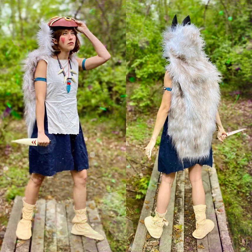 a woman cosplaying as san from princess mononoke. the cosplay is very detailed, including a white dress, a fur cape, a mask, and boots.  the images are two separate shots showing the front and back of the costume. she's posed outdoors in a forest setting.  the cosplay accurately captures the character's appearance and the environment matches the film's aesthetic.