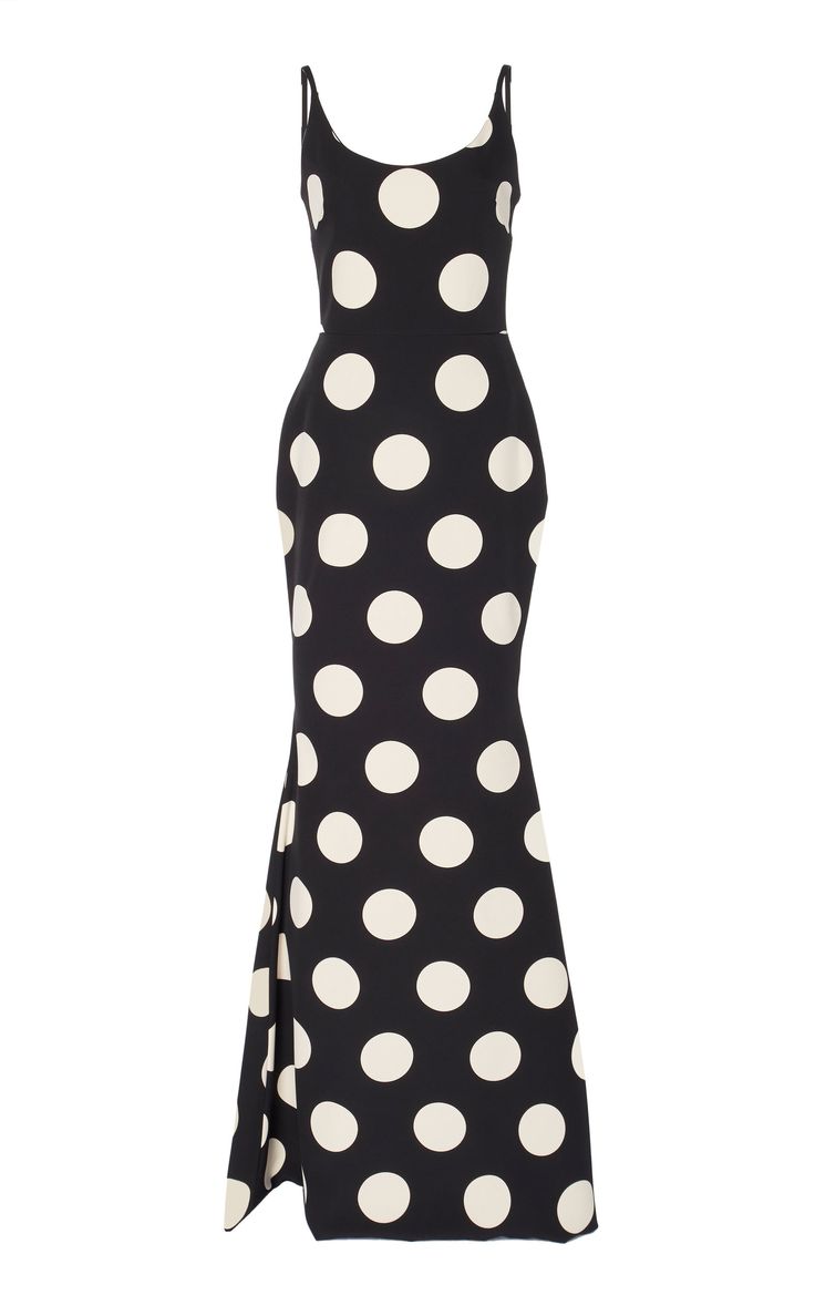 a black and white polka dot spaghetti strap dress in a fitted mermaid silhouette.