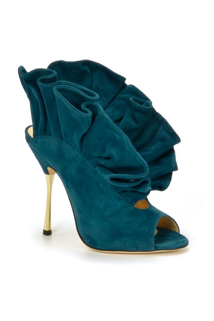 a single teal, suede high heel shoe with ruffles is displayed on a white background. the shoe has a peep toe and a stiletto heel.