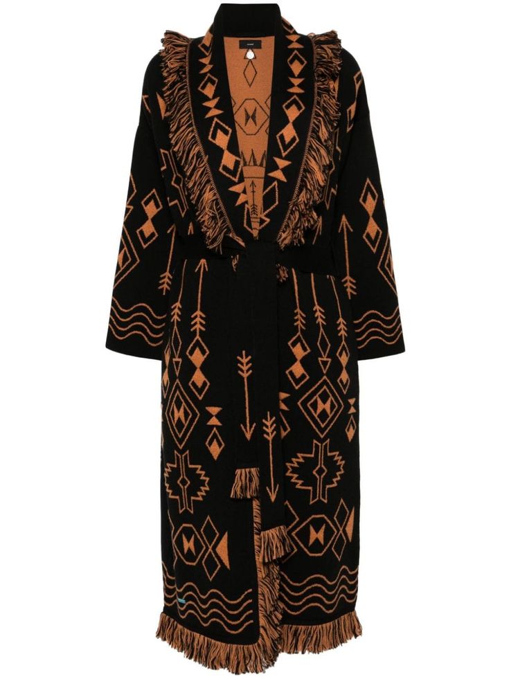 a black and brown long knit cardigan with a geometric pattern and fringe trim. the cardigan has a shawl collar, long sleeves, and a belted waist. it is a stylish and cozy piece of clothing that would be perfect for fall or winter.