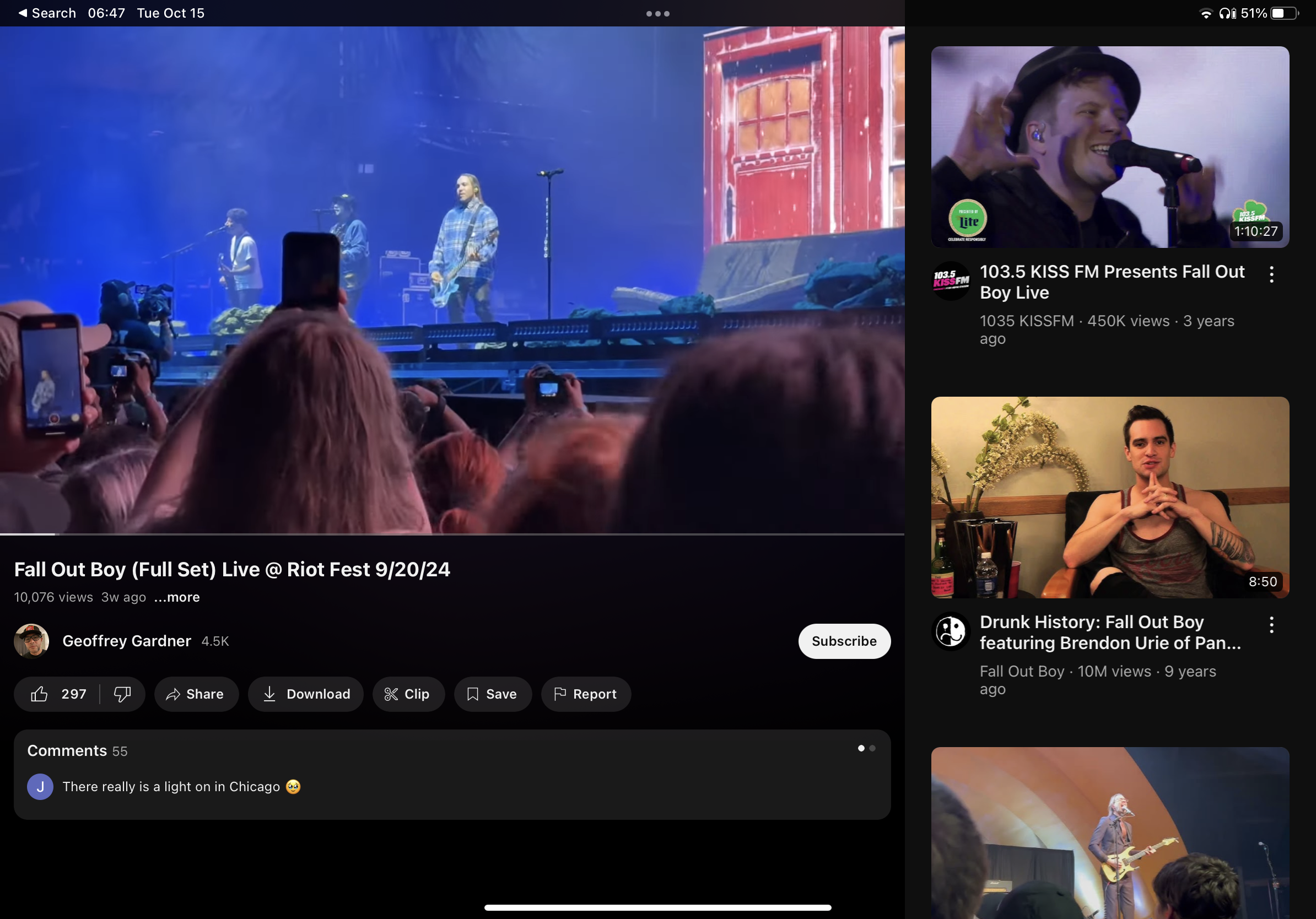 a screenshot of a youtube video about fall out boy's performance at riot fest. the video is being watched on an ipad. the screenshot shows a split screen with the video on the left and two other videos on the right. the video on the left shows the band performing on stage in front of a large crowd. the two videos on the right show interviews with the band. the bottom of the screen shows information about the video, including the title, number of views, and date uploaded. there is a comment section below the video information.  the comment says "there really is a light on in chicago." there are also a number of buttons at the bottom of the screen, including buttons to share the video, download it, clip it, save it, and report it.