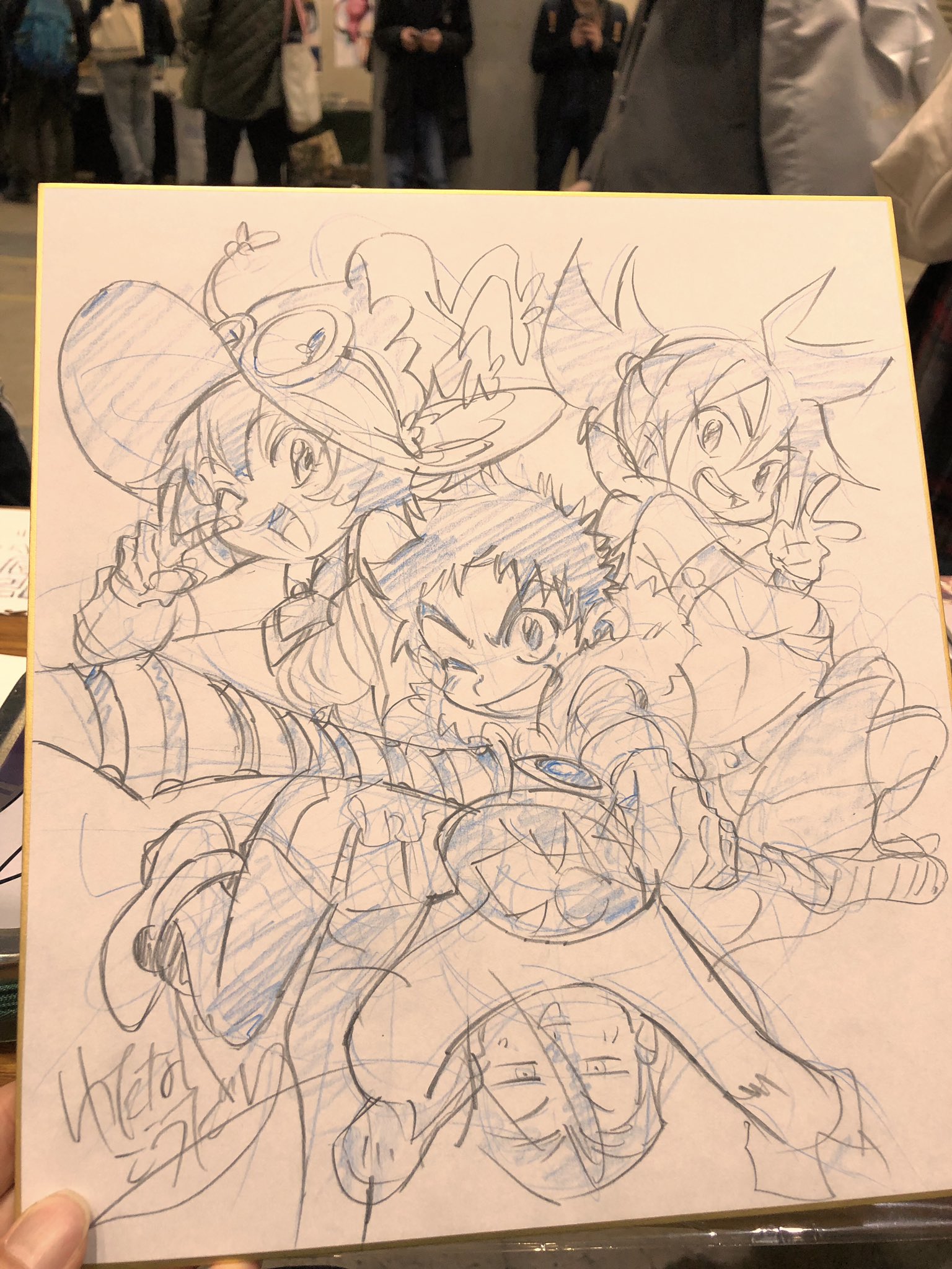 the image shows a handdrawn sketch of four animestyle characters in dynamic poses, piled playfully on top of each other. it appears to be on a standard drawing pad, and the background is a simple offwhite. the lines of the sketch are done in blue pencil, with some shading and detail. the characters' expressions are lively and energetic. there is a signature in cursive at the bottom left of the drawing.