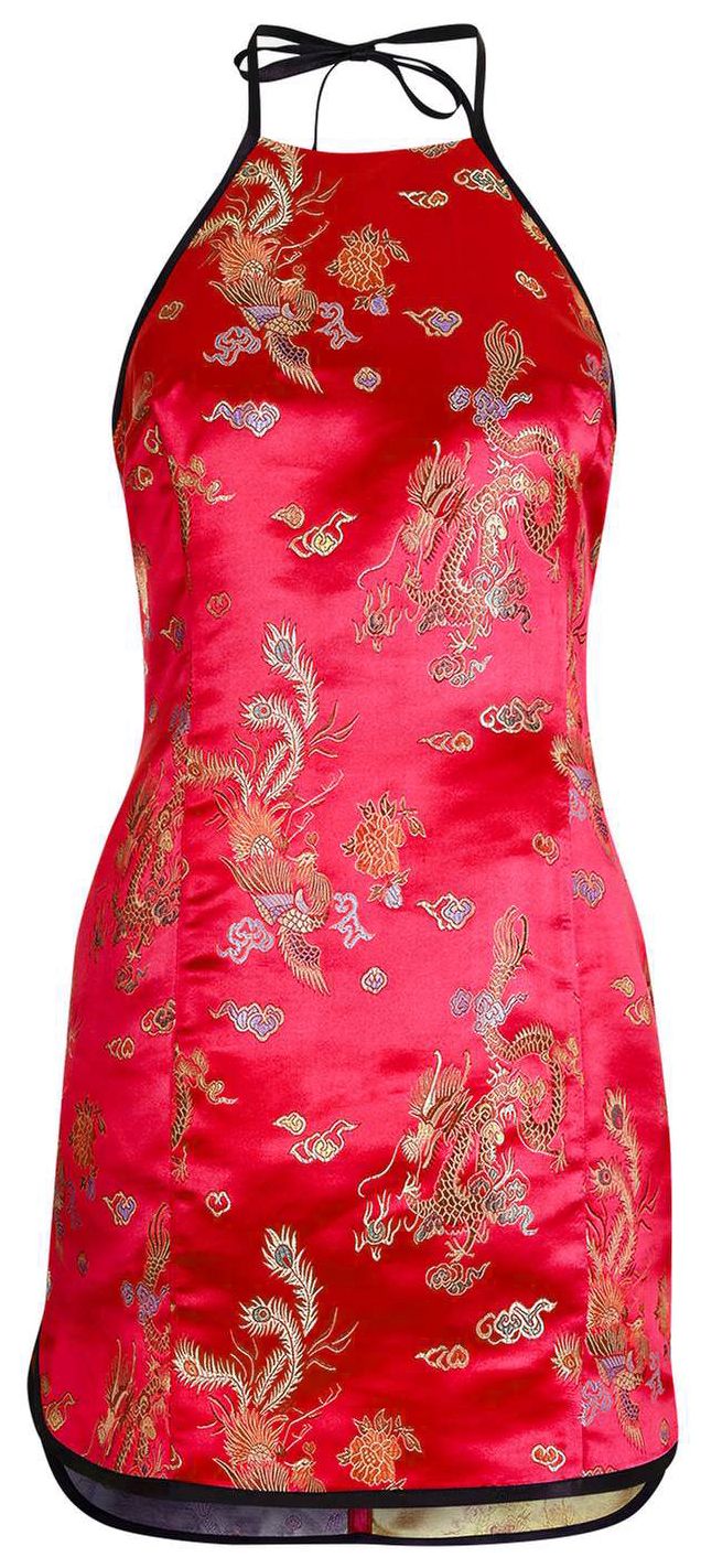 a red, silk mini dress with black halter straps is presented in a studio shot. the dress features a chinese dragon and phoenix pattern in gold.