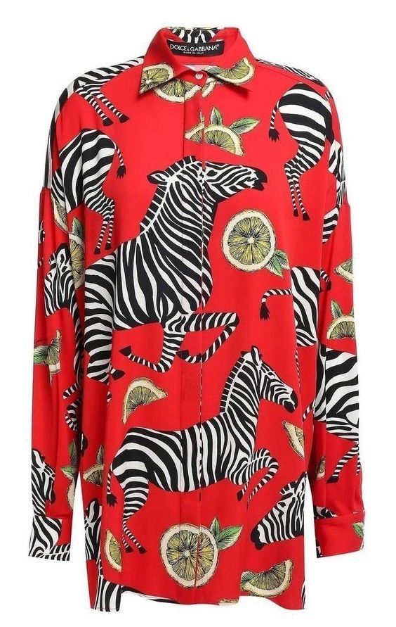 a red longsleeved shirt with a zebra and lemon print is displayed. the shirt has a collar and buttons down the front. the zebra print features black and white stripes, while the lemon print includes sliced lemons with green leaves. the shirt is likely made of silk or a similar lightweight fabric.