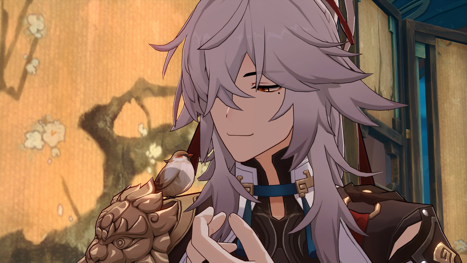 a close up of the anime character albedo from genshin impact. he has long white hair and blue eyes. he is smiling and holding a small white bird in his hand. he is wearing a black and gold outfit with red and blue accents.