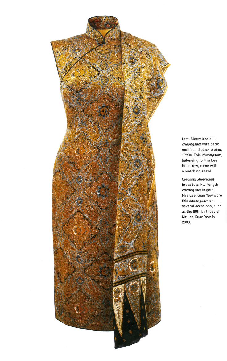 a sleeveless silk cheongsam with batik motifs and black piping from the 1990s, which belonged to mrs. lee kuan yew and came with a matching shawl. the image also mentions a sleeveless brocade anklelength cheongsam in gold that mrs. lee kuan yew wore on several occasions, such as the 80th birthday of mr. lee kuan yew in 2003. the focus of the image is on the silk cheongsam.