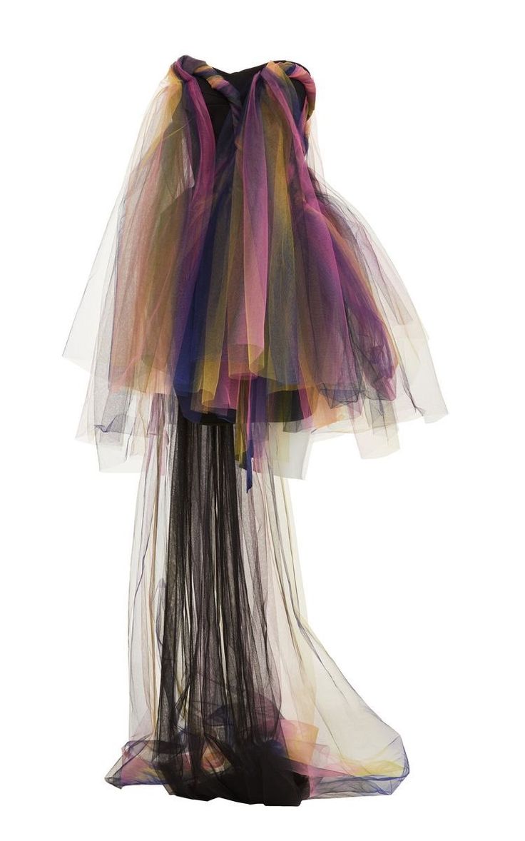 a stunning, vibrant rainbow tulle dress with an ombre effect. the dress is made of layers of sheer tulle, creating a dramatic, flowy silhouette. the dress is perfect for a special occasion, such as a prom, wedding, or black tie event.