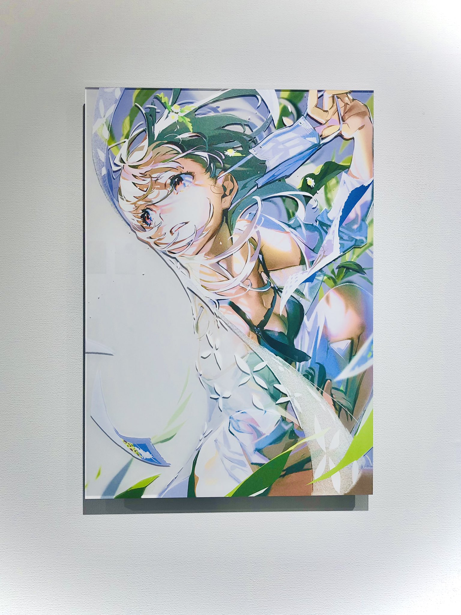 a print of an anime girl in a white shirt with transparent sleeves and a black swimsuit underneath. the girl is facing up, toward the top left, and smiling with her eyes closed. she appears to be happy and enjoying the sunshine. there is a blue transparent object in her right hand, but it's unclear what it is. the background is a window and some green bamboo, which suggests it's summer. the artwork is printed on an acrylic board, and the image is cropped to only show the print without any background.