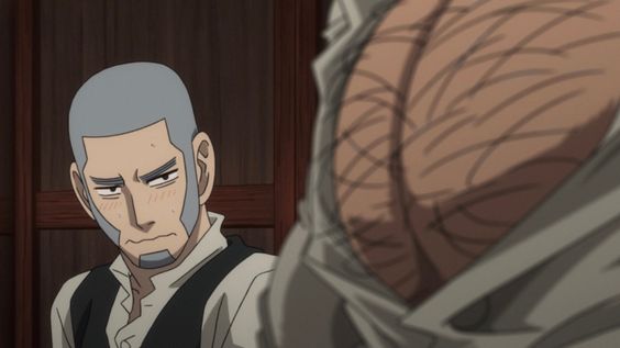 this image shows a close up screenshot from an animated film or series. the image shows one man with short grey hair and stubble, and a partial view of another man. the image is relatively dark. the man on the left side of the screen appears to be blushing. the man on the right appears to have several large scars covering his torso.