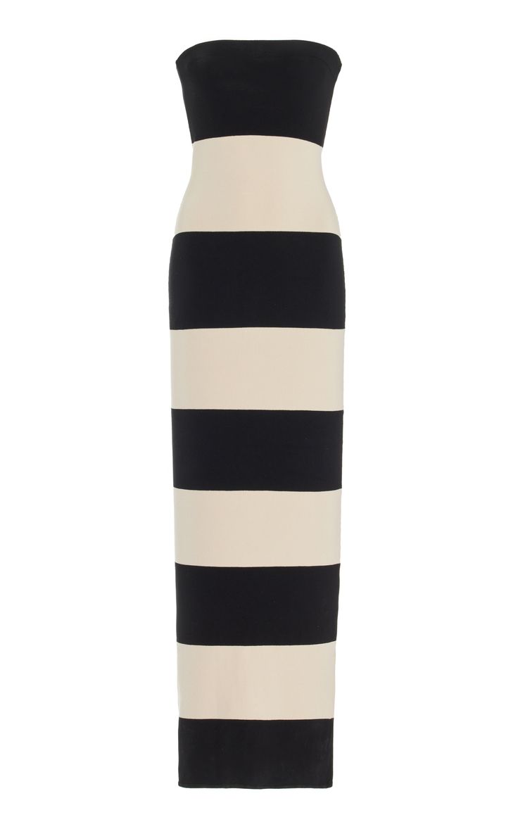 a black and white striped strapless maxi dress. the dress is a simple design, with no embellishments or accessories. it would be perfect for a summer day or evening out.