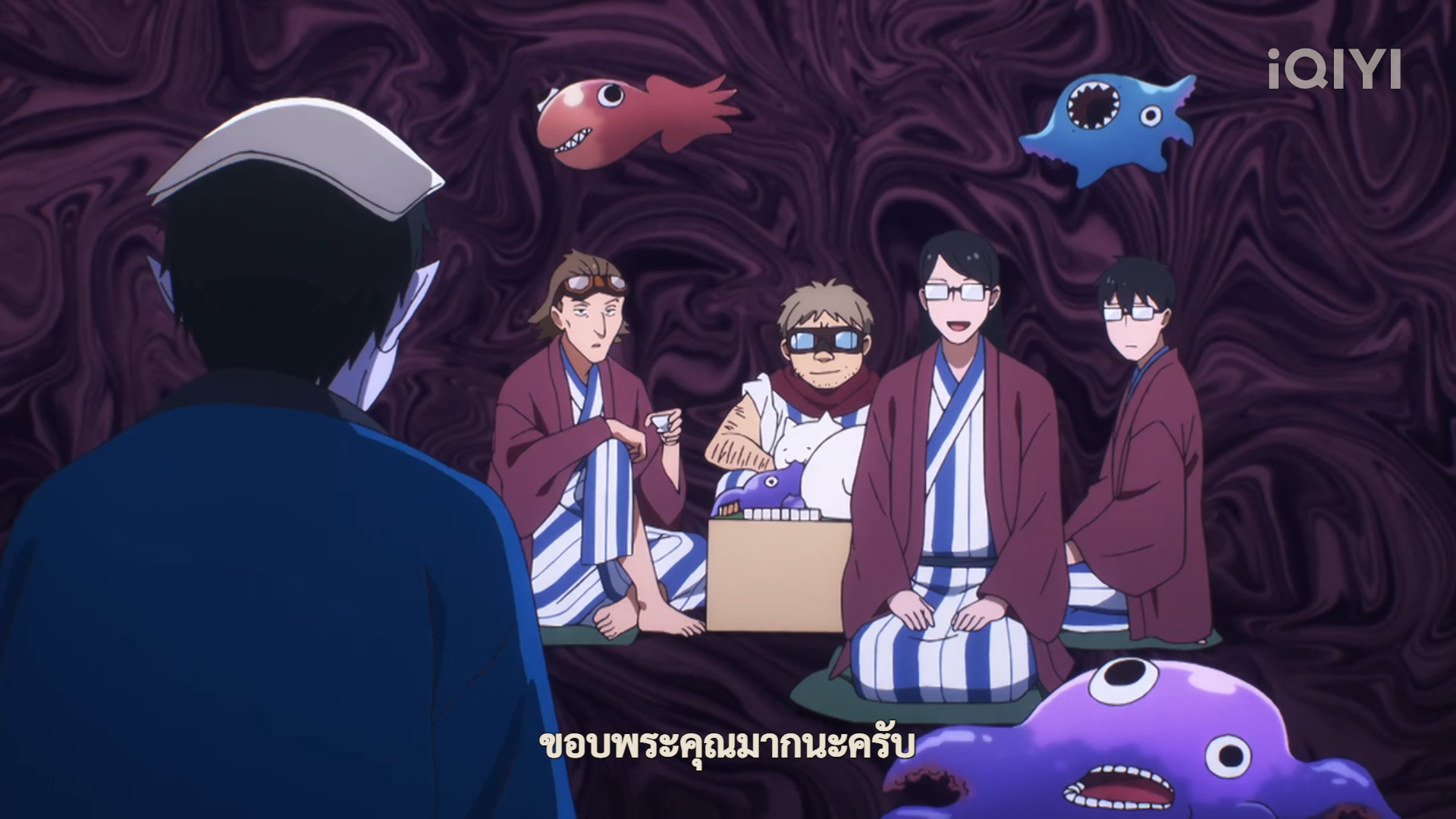 a screenshot from what seems to be a japanese animation show, features a man in blue facing away from the camera. he appears to be speaking to a group of four people sitting in a circle. they are in a room with a dark, swirling purple background and strange, colorful, cartoonish creatures are floating around them. the overall tone is whimsical and slightly unsettling.