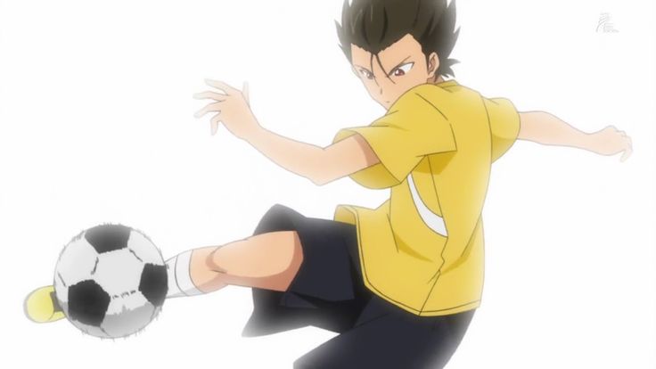 an anime boy is in midkick, his right leg extended towards the ball. he wears a yellow jersey with white accents and black shorts. his eyes are determined, and his hair is dark and windblown. the soccer ball is in focus, the rest of the background is blurred.  the image is dynamic and energetic, capturing the excitement of the game.