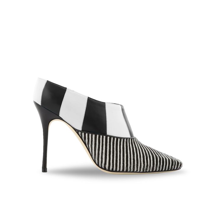 a highheeled shoe with a black and white striped pattern is shown in the image. the upper part of the shoe is crafted from alternating black and white leather panels, while the lower portion features vertical black and white stripes. the heel is a thin stiletto. the shoe is placed on a white background.