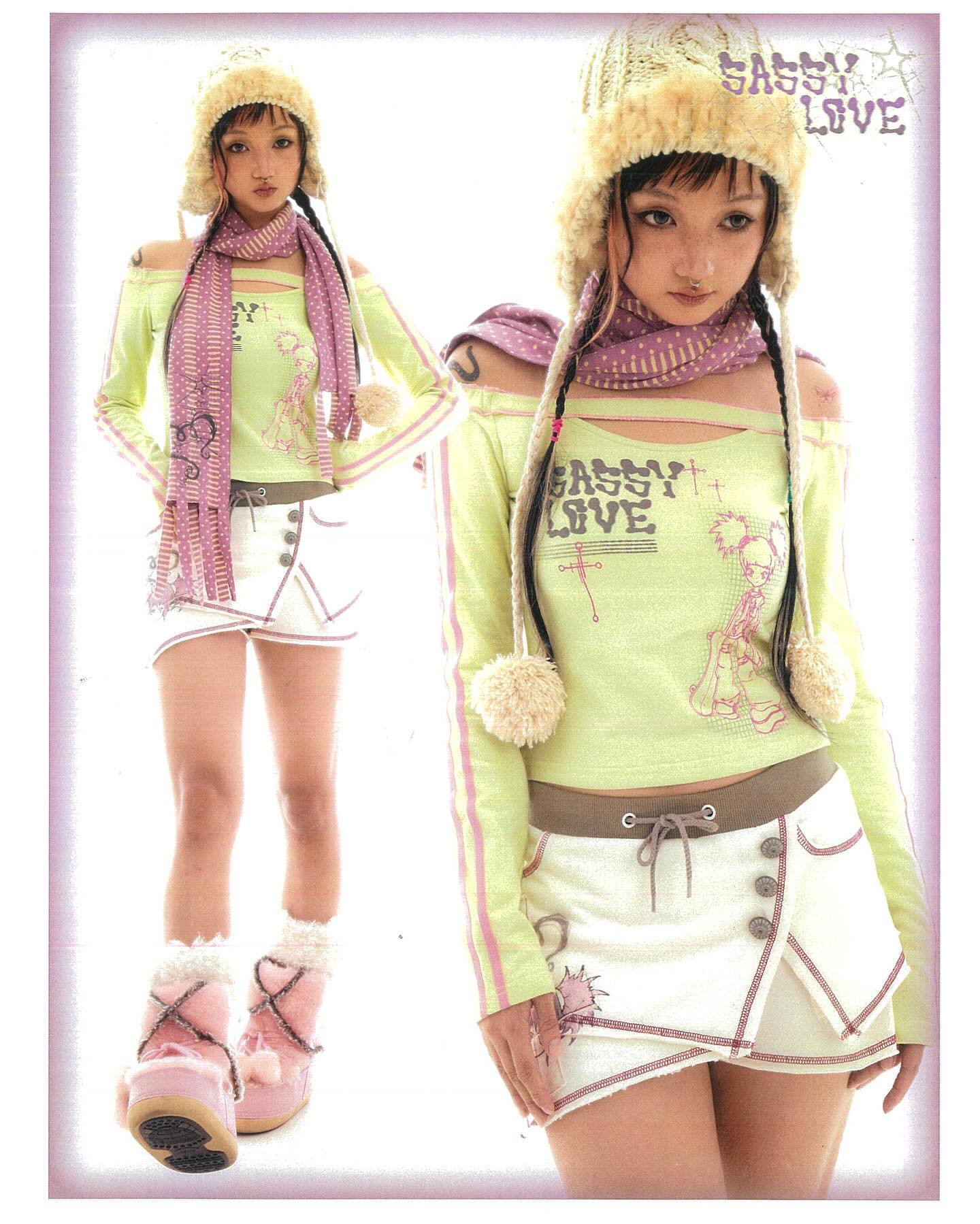 the image shows two images of a young woman, both showcasing the same style of outfit. the outfit includes an offtheshoulder pastel green longsleeved top with the words "sassy love" printed on it, a white layered skirt,  a pink and purple striped scarf, a furry knit hat, and pink fluffy boots. the overall style is kawaii, a japanese fashion aesthetic characterized by cuteness and pastel colors. the model is posing in a studio setting against a light background.  the brand name "sassy love" is visible prominently on the clothing and in the background.