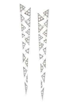 a pair of silver diamond earrings with a geometric, triangular pattern. the earrings are minimalist in design and have a modern aesthetic. they are perfect for adding a touch of sparkle to any outfit.