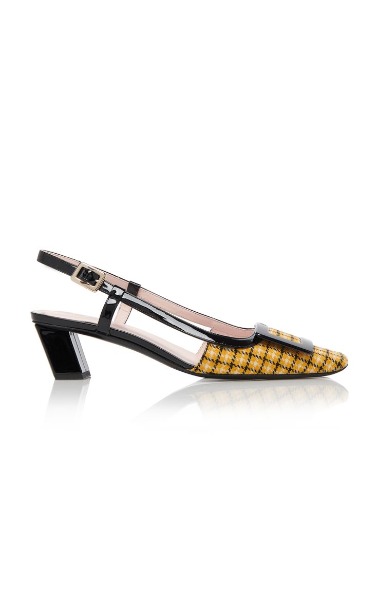a pair of women's yellow plaid slingback heels with a black platform sole.