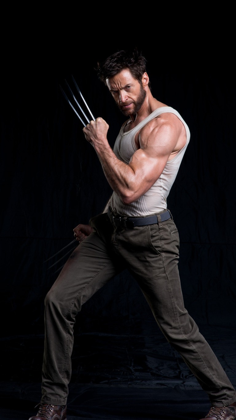 a fullbody studio portrait of actor hugh jackman as wolverine, standing in a dynamic pose with his claws extended. he is wearing a white tank top, brown pants, and brown boots. the background is black.