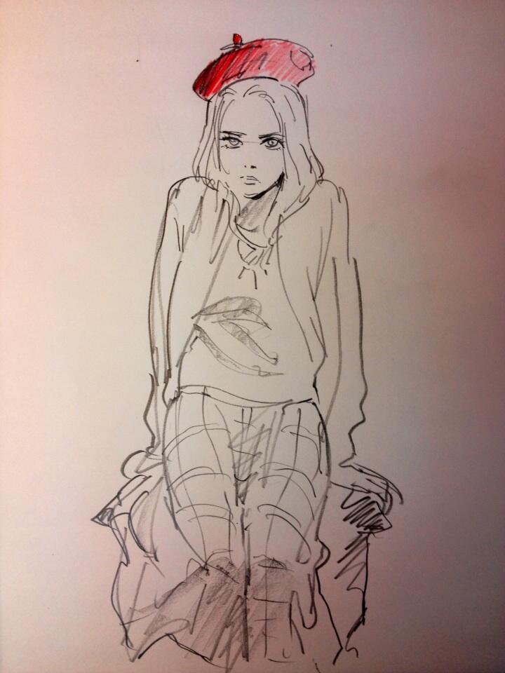 a quick sketch of a woman wearing a red beret and casual clothing, possibly an art student. the drawing style is loose and expressive.  the background is a plain white surface.